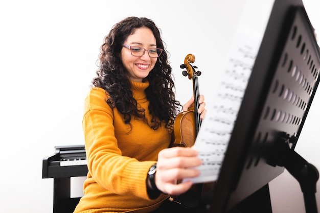 Professional singing lessons instructor demonstrating vocal techniques during music training session